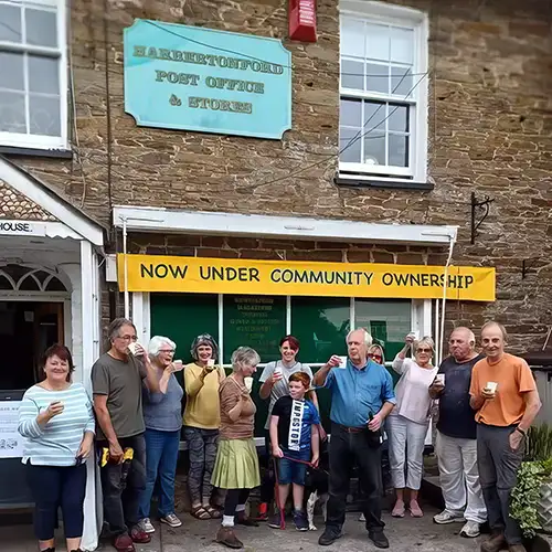 The community outside the shop celebrating